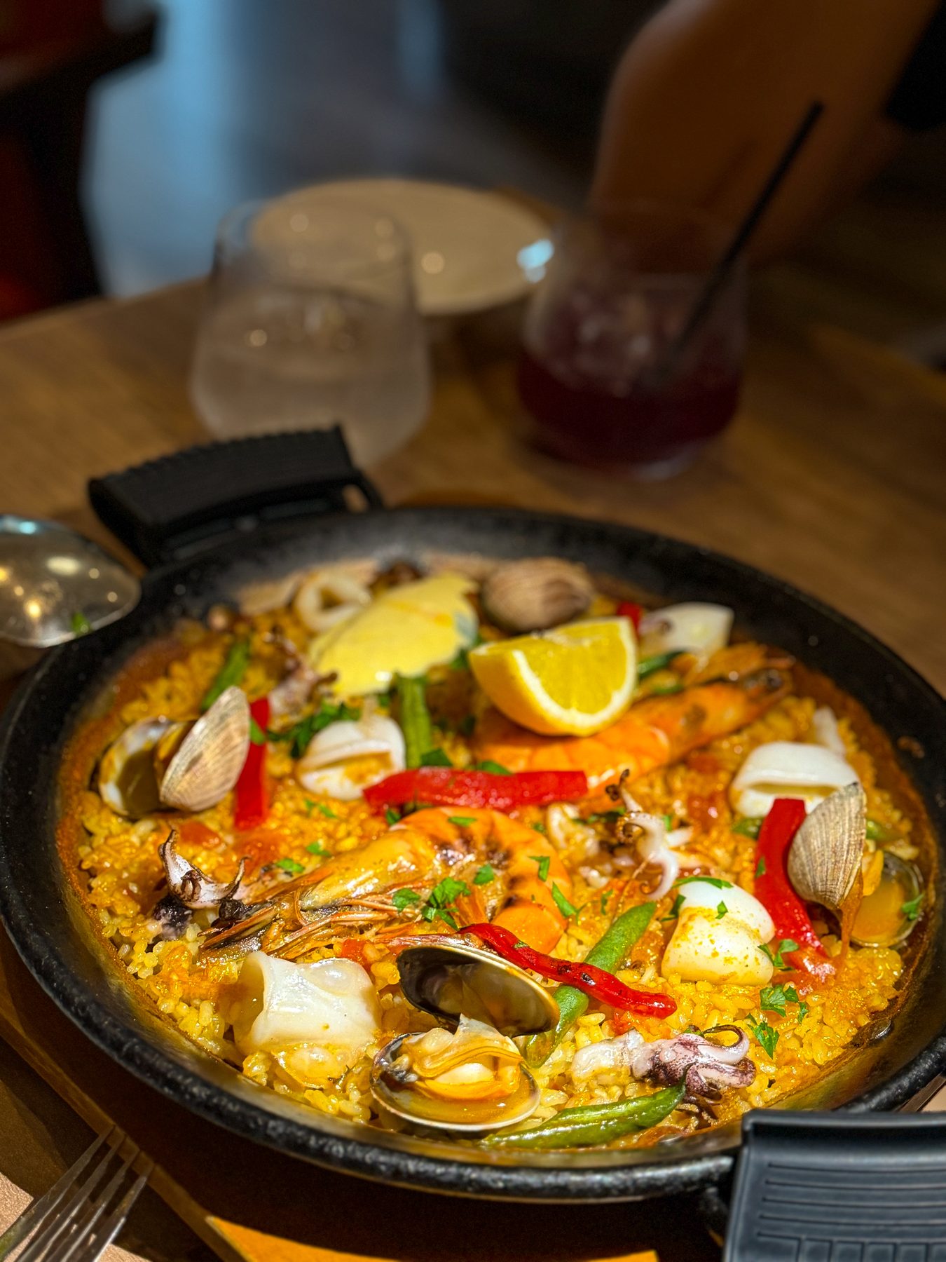 Seafood paella with saffron rice, shrimp, clams and vegetables