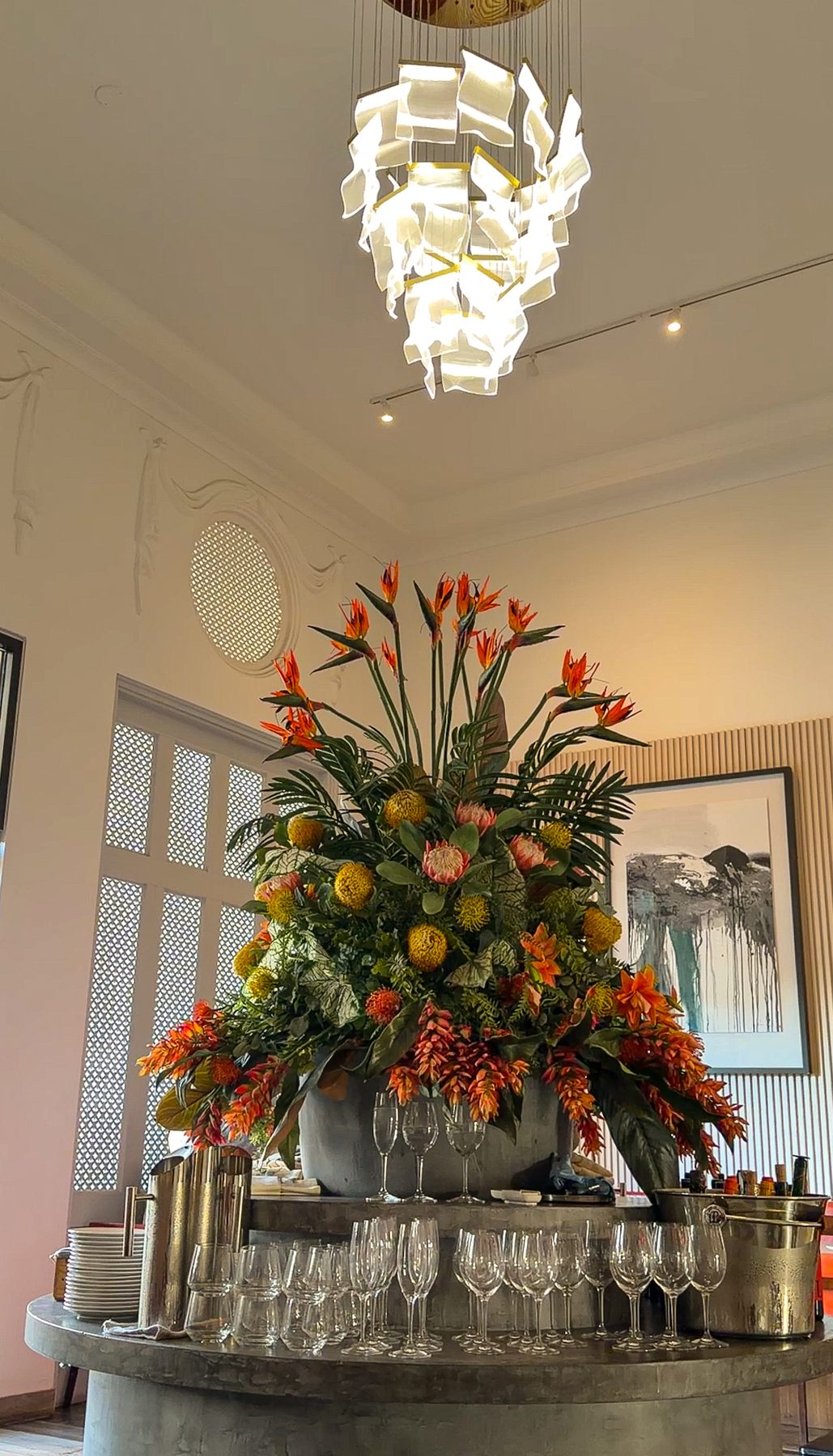 El Cielo dining room interior with stunning floral arrangement and chandelier